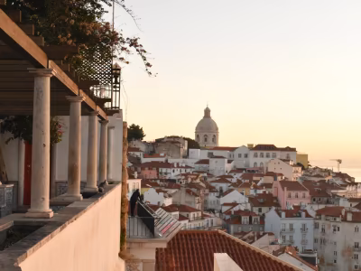 Traditional tiled façades along a narrow Alfama street in Lisbon
