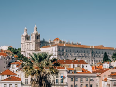 Whitewashed and ochre heritage buildings in historic Lisbon